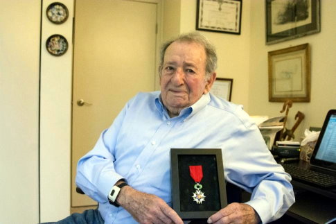 bob levine holding medal