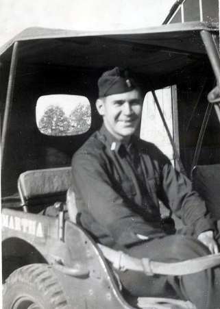 1st Lt. Chas P. Macke in his Jeep